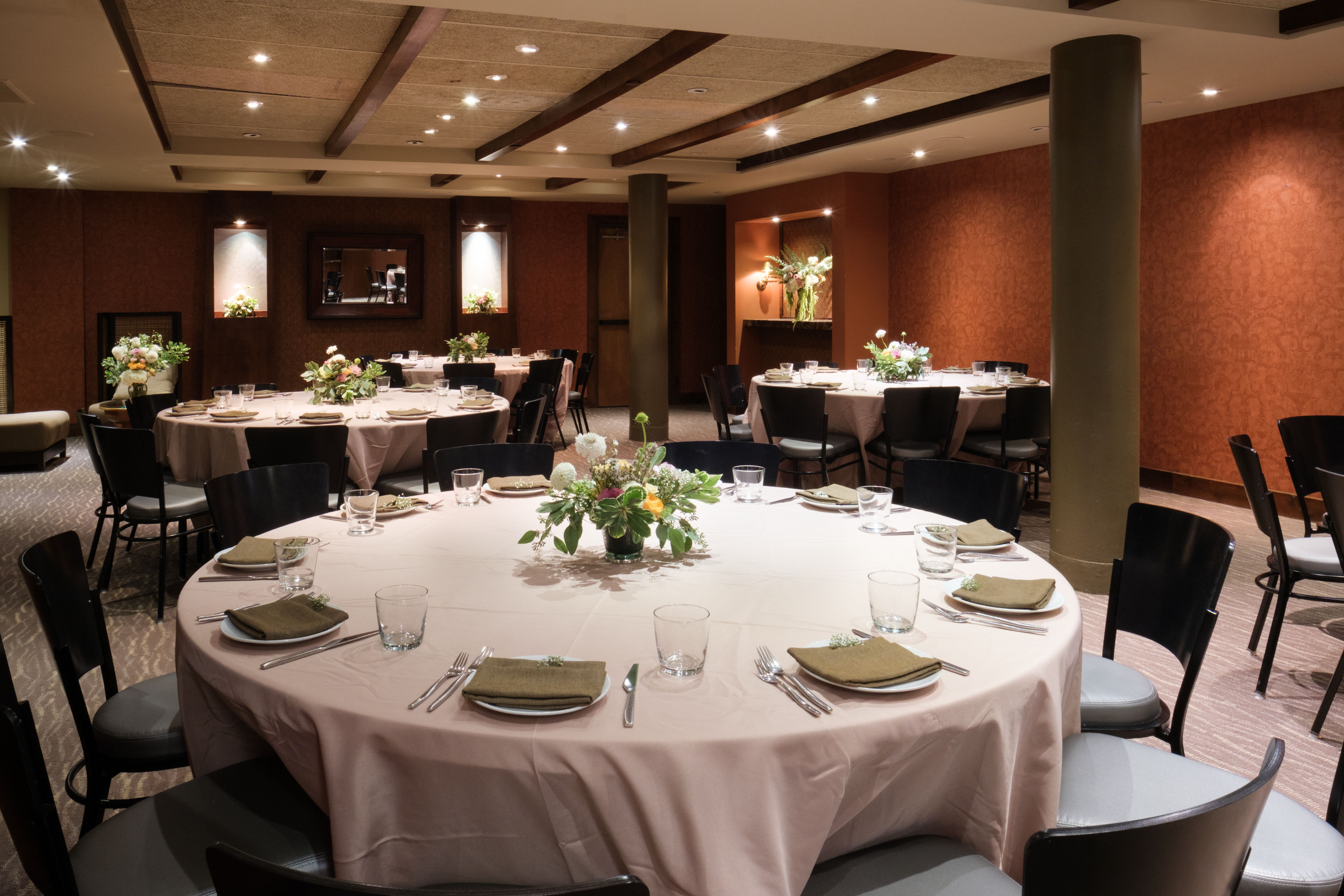 Cinnabar ballroom with round tables and floral centerpieces
